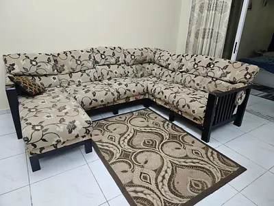L-shaped fabric sectional sofa with ottoman - floral pattern, good condition