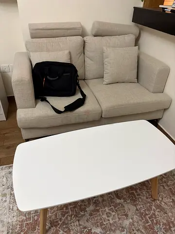 Light beige single armchair with cushions and table - good condition