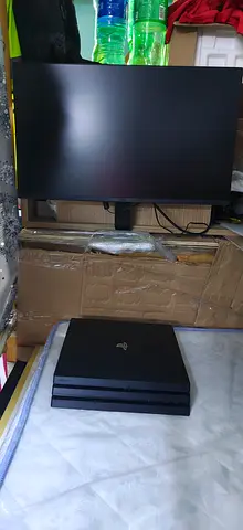 Ps4 pro and LG monitor with two game disc