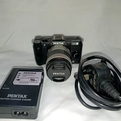 Pentax Q10 Mirrorless (shutter count is 709)