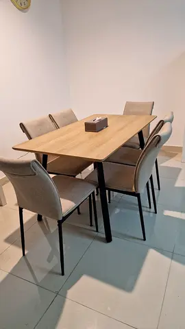 Wooden dining table with 6 upholstered chairs - good condition