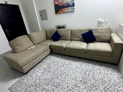 L-shaped beige fabric sofa with chaise - good condition