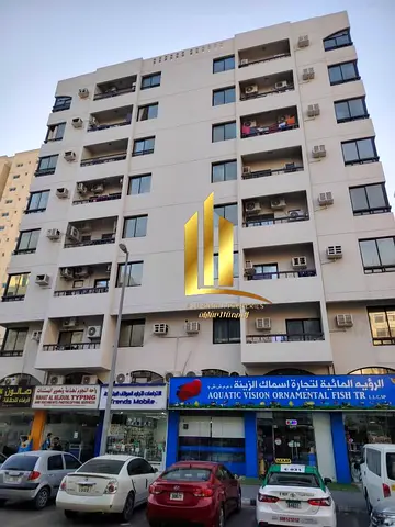 Prime Investment Building for Sale in Abu Shagara with Strong Annual Income on a Main 30-Meter Road