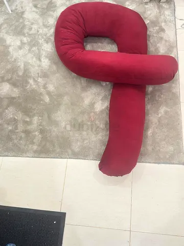 Long red pregnancy/nursing support body pillow