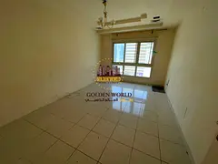For annual rent in Al Majaz 1: Two bedrooms, living room, lounge with balcony, free air conditioning