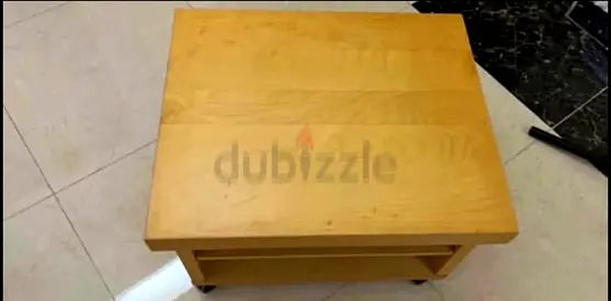 Simple light wood side table with shelf