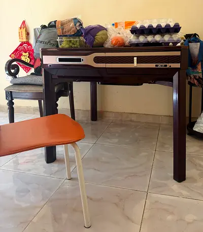 Solid wood dining table with built-in drawer - good condition