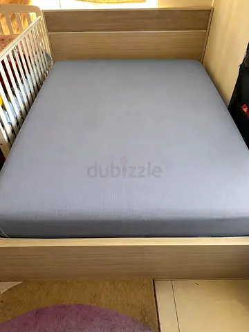 Queen-size wooden bed frame with mattress - good condition