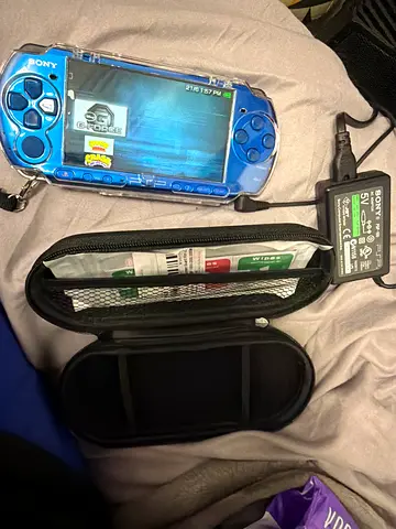 Sony PSP in blue with case , protector case screen guard and charger - modded with games
