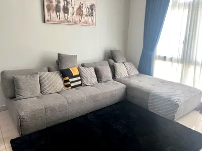Light grey L-shaped fabric sofa with chaise - good condition