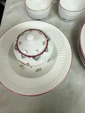 Set of ceramic  dinner set with bowls, tea cups and sugar jar - white with red trim