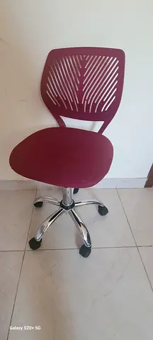 Red swivel srudy chair with chrome base — good condition