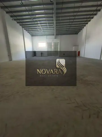 A prime warehouse for rent in Al Jurf Industrial Area 3, with an area of ​​5500 sq ft and 50 kW of electricity.