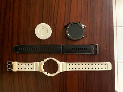 Smartwatch body and two replacement straps (parts only) - with charger.