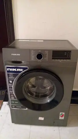 Nikai 7kg front-load washing machine, 2 years old. Washes and spins normally except for the draining