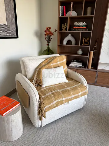 Retractable armchair converts into bed
