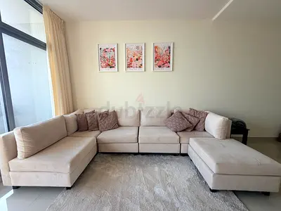 Light beige L-shaped sectional sofa with ottoman - excellent condition