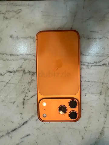 Used iPhone (orange case) with triple camera - like new condition