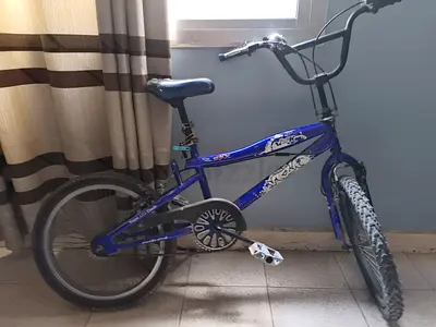 Blue kids BMX-style bicycle, good condition