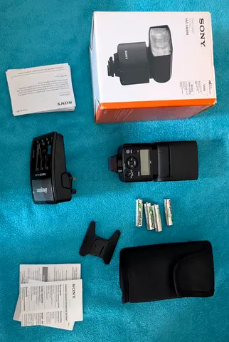 📸 Sony HVL-F46RM Flash  Power Kit  ​Sony HVL-F46RM Flash: With box.  ​🔋 Power: Charger and 4 rech