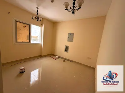 Spacious 1-bedroom apartment in Al Butina with central AC and gas, deluxe finishing, close to all services, and easy access to Dubai and Ajman.