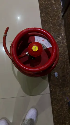 Used small red LPG gas cylinder with hose (compact)