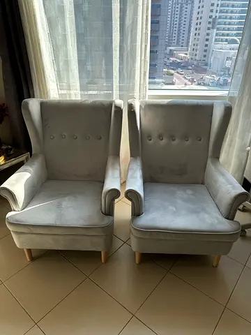 Pair of light grey upholstered wingback armchairs - good condition