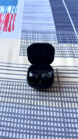 Used wireless earbuds with charging case - good working condition