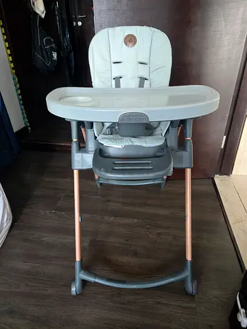 Gently used baby high chair with adjustable tray and recline