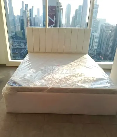 White upholstered double bed with storage base - good condition
