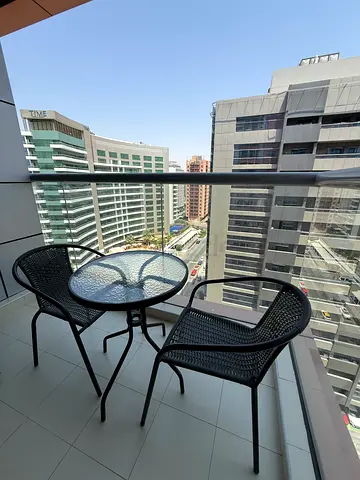 Outdoor bistro set – glass top table with two metal chairs