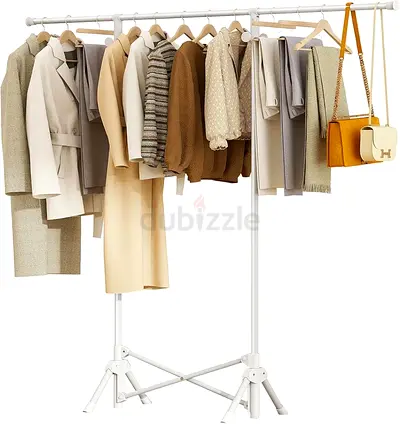 Clothing rack with assorted womens coats, jackets and tops