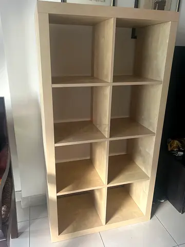 Selling my IKEA KALLAX shelf unit in white/oak finish. Great for books, display, or storage.
