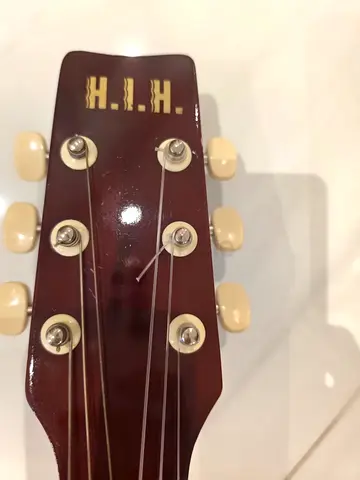 H.I.H. branded acoustic guitar — headstock shown, good working tuners