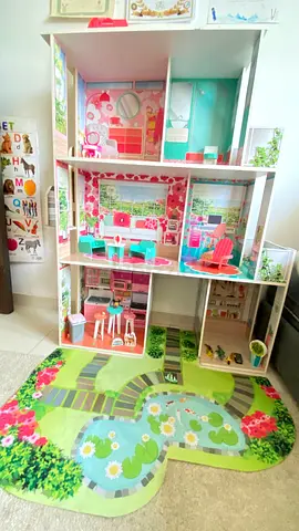 Large wooden dollhouse with play mat and furniture