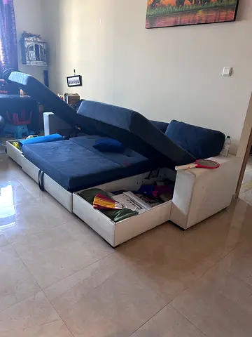 Blue velvet L-shape sectional sofa bed with storage — good condition