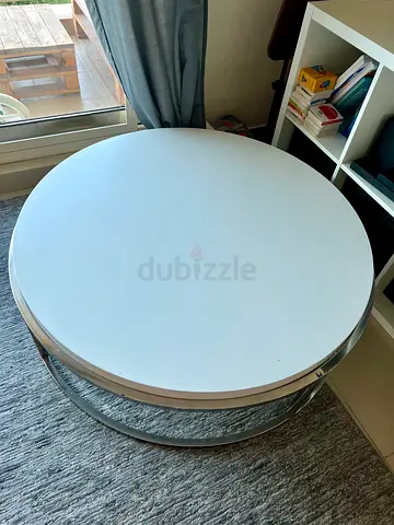 Round white coffee table with metal base - good condition