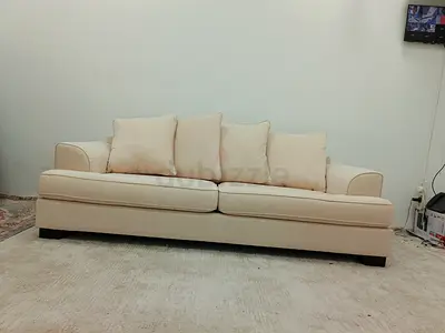 The one brand beige color 3 seater sofa