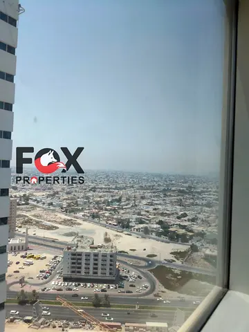 3 master bedrooms with a living room for annual rent in Ajman One Towers, including a maid’s room with bathroom, closed kitchen, and laundry room, mod
