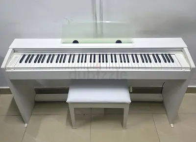 The Casio PX-770 w Privia is a popular, slim-profile 88-key digital console piano. It combines