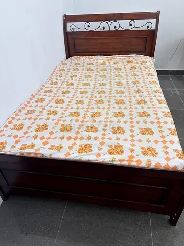 Solid Wooden Single Bed Frame with Headboard and medical Mattress without bed sheet.