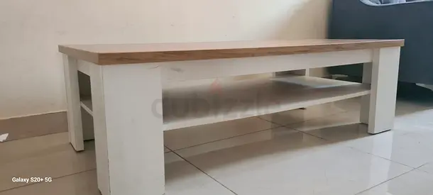 Solid wood coffee table with lower shelf — light oak top, white legs