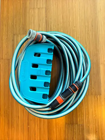 Gardena garden hose with wall mount holder - 10m (used)