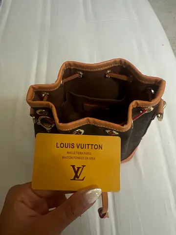 Louis Vuitton Mini Monogram Bucket Bag with Dog Charm