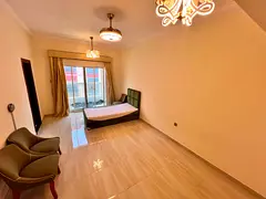 Furnished studio with free internet, semi-separate kitchen, and balcony.
