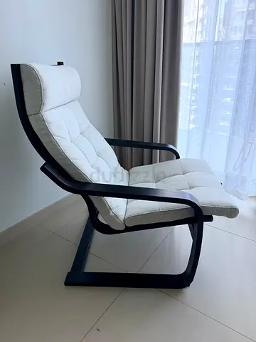 Comfortable modern lounge chair with curved wooden frame