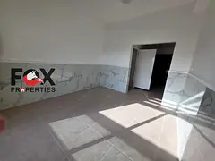 Annual rental in Al Rawda 2, Ajman. 1-bedroom apartment with living room, balcony, laundry room, and