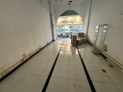 Commercial space for annual rent in Sharjah - Al Majaz 2 | Glass storefront | Suitable for all businesses | Prime location | Ready to operate