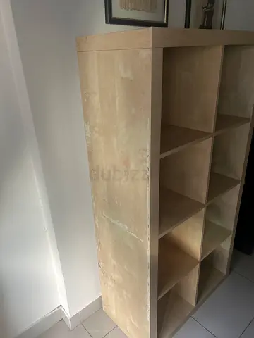 Selling my IKEA KALLAX shelf unit in white/oak finish. Great for books, display, or storage.