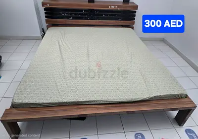 King-size wooden bed frame with headboard - good condition